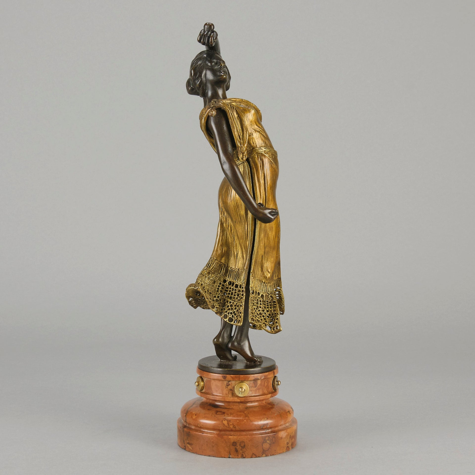 Flamenco Dancer by T Curts a charming Art Nouveau bronze figure of a flamboyant flamenco dancer holding a striking pose, her diaphonous gilded dress seductively draped over her, pinned and hinged to be removed in order to reveal her beautiful naked body