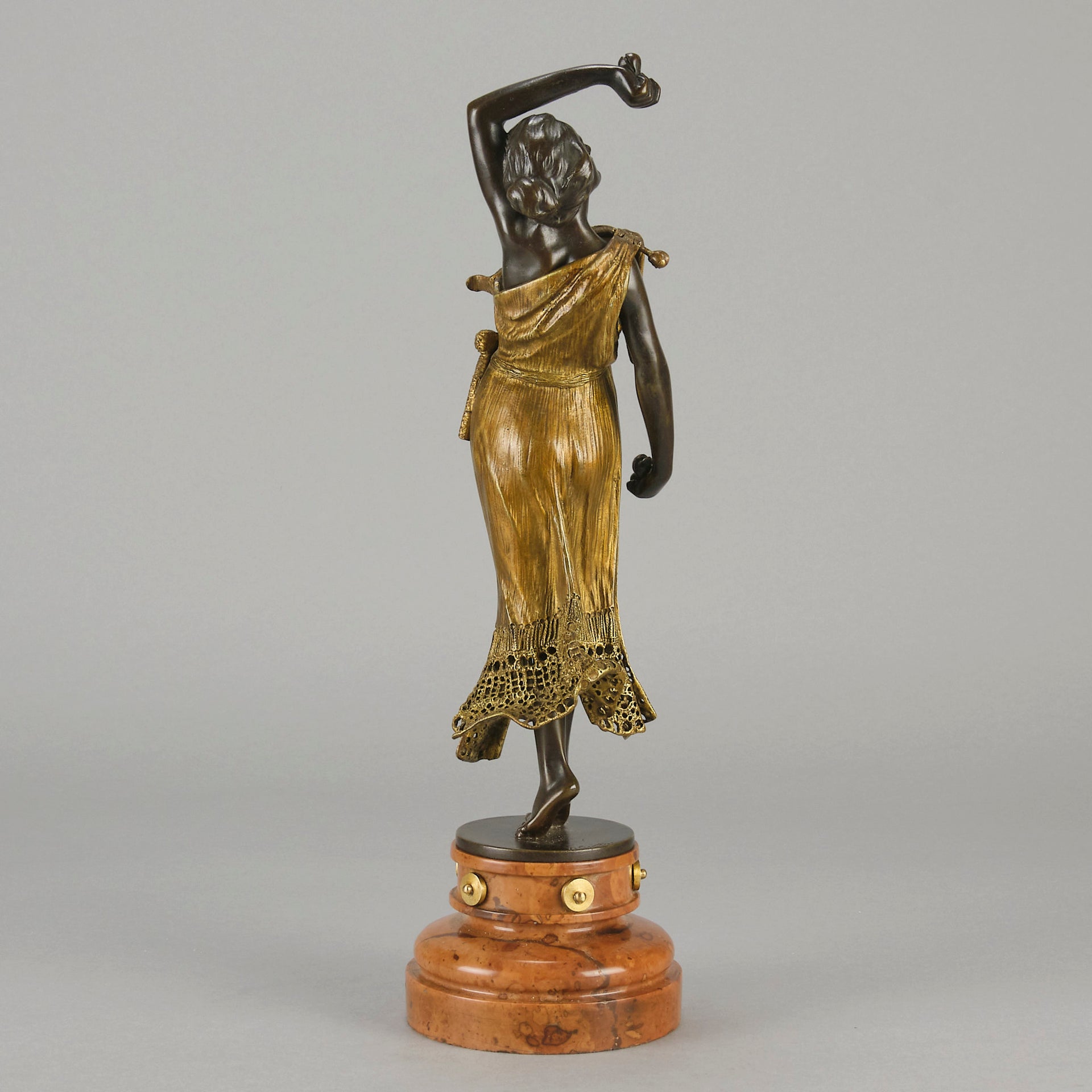 Flamenco Dancer by T Curts a charming Art Nouveau bronze figure of a flamboyant flamenco dancer holding a striking pose, her diaphonous gilded dress seductively draped over her, pinned and hinged to be removed in order to reveal her beautiful naked body