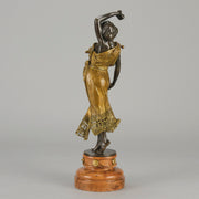 Flamenco Dancer by T Curts a charming Art Nouveau bronze figure of a flamboyant flamenco dancer holding a striking pose, her diaphonous gilded dress seductively draped over her, pinned and hinged to be removed in order to reveal her beautiful naked body