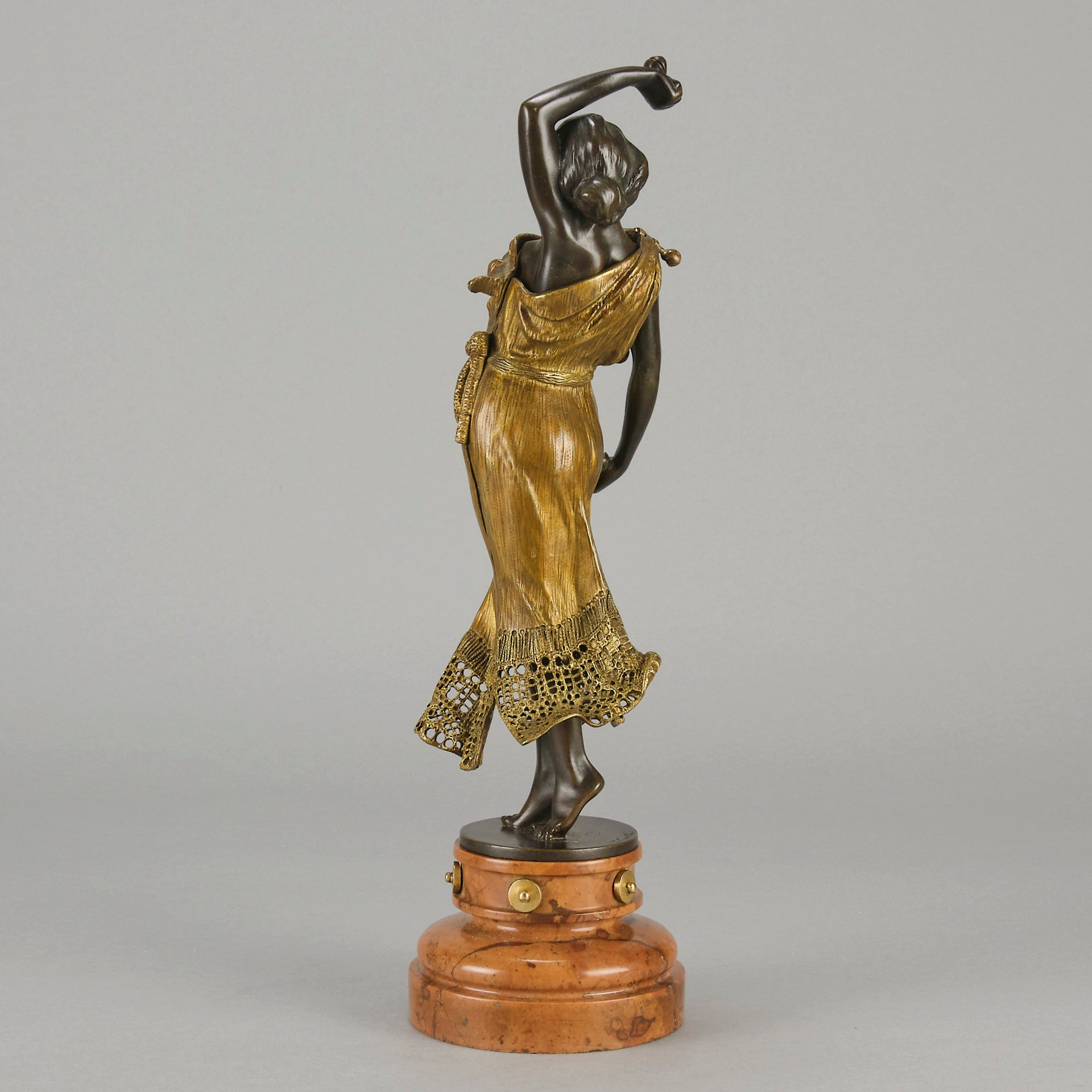 Flamenco Dancer by T Curts a charming Art Nouveau bronze figure of a flamboyant flamenco dancer holding a striking pose, her diaphonous gilded dress seductively draped over her, pinned and hinged to be removed in order to reveal her beautiful naked body