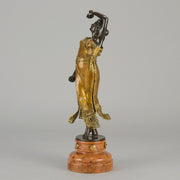 Flamenco Dancer by T Curts a charming Art Nouveau bronze figure of a flamboyant flamenco dancer holding a striking pose, her diaphonous gilded dress seductively draped over her, pinned and hinged to be removed in order to reveal her beautiful naked body