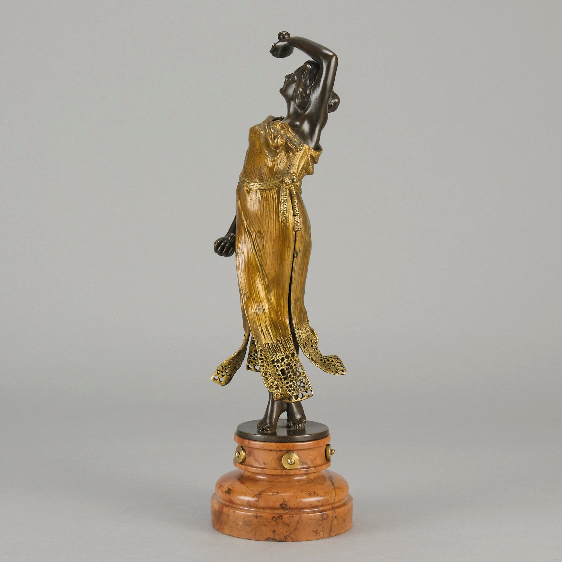 Flamenco Dancer by T Curts a charming Art Nouveau bronze figure of a flamboyant flamenco dancer holding a striking pose, her diaphonous gilded dress seductively draped over her, pinned and hinged to be removed in order to reveal her beautiful naked body