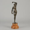 Flamenco Dancer by T Curts a charming Art Nouveau bronze figure of a flamboyant flamenco dancer holding a striking pose, her diaphonous gilded dress seductively draped over her, pinned and hinged to be removed in order to reveal her beautiful naked body