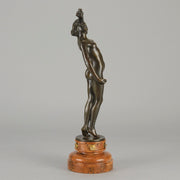 Flamenco Dancer by T Curts a charming Art Nouveau bronze figure of a flamboyant flamenco dancer holding a striking pose, her diaphonous gilded dress seductively draped over her, pinned and hinged to be removed in order to reveal her beautiful naked body