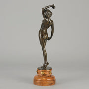 Flamenco Dancer by T Curts a charming Art Nouveau bronze figure of a flamboyant flamenco dancer holding a striking pose, her diaphonous gilded dress seductively draped over her, pinned and hinged to be removed in order to reveal her beautiful naked body
