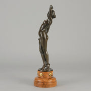 Flamenco Dancer by T Curts a charming Art Nouveau bronze figure of a flamboyant flamenco dancer holding a striking pose, her diaphonous gilded dress seductively draped over her, pinned and hinged to be removed in order to reveal her beautiful naked body
