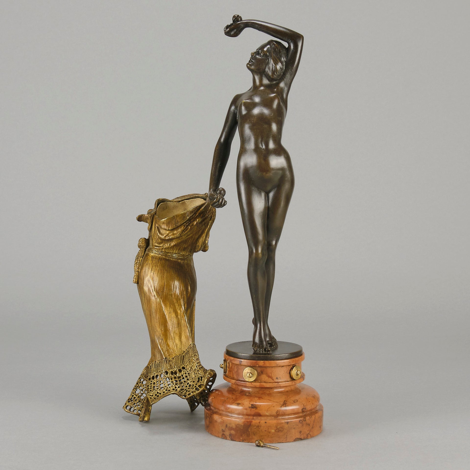 Flamenco Dancer by T Curts a charming Art Nouveau bronze figure of a flamboyant flamenco dancer holding a striking pose, her diaphonous gilded dress seductively draped over her, pinned and hinged to be removed in order to reveal her beautiful naked body