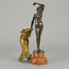 Flamenco Dancer by T Curts a charming Art Nouveau bronze figure of a flamboyant flamenco dancer holding a striking pose, her diaphonous gilded dress seductively draped over her, pinned and hinged to be removed in order to reveal her beautiful naked body