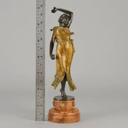 Flamenco Dancer by T Curts a charming Art Nouveau bronze figure of a flamboyant flamenco dancer holding a striking pose, her diaphonous gilded dress seductively draped over her, pinned and hinged to be removed in order to reveal her beautiful naked body
