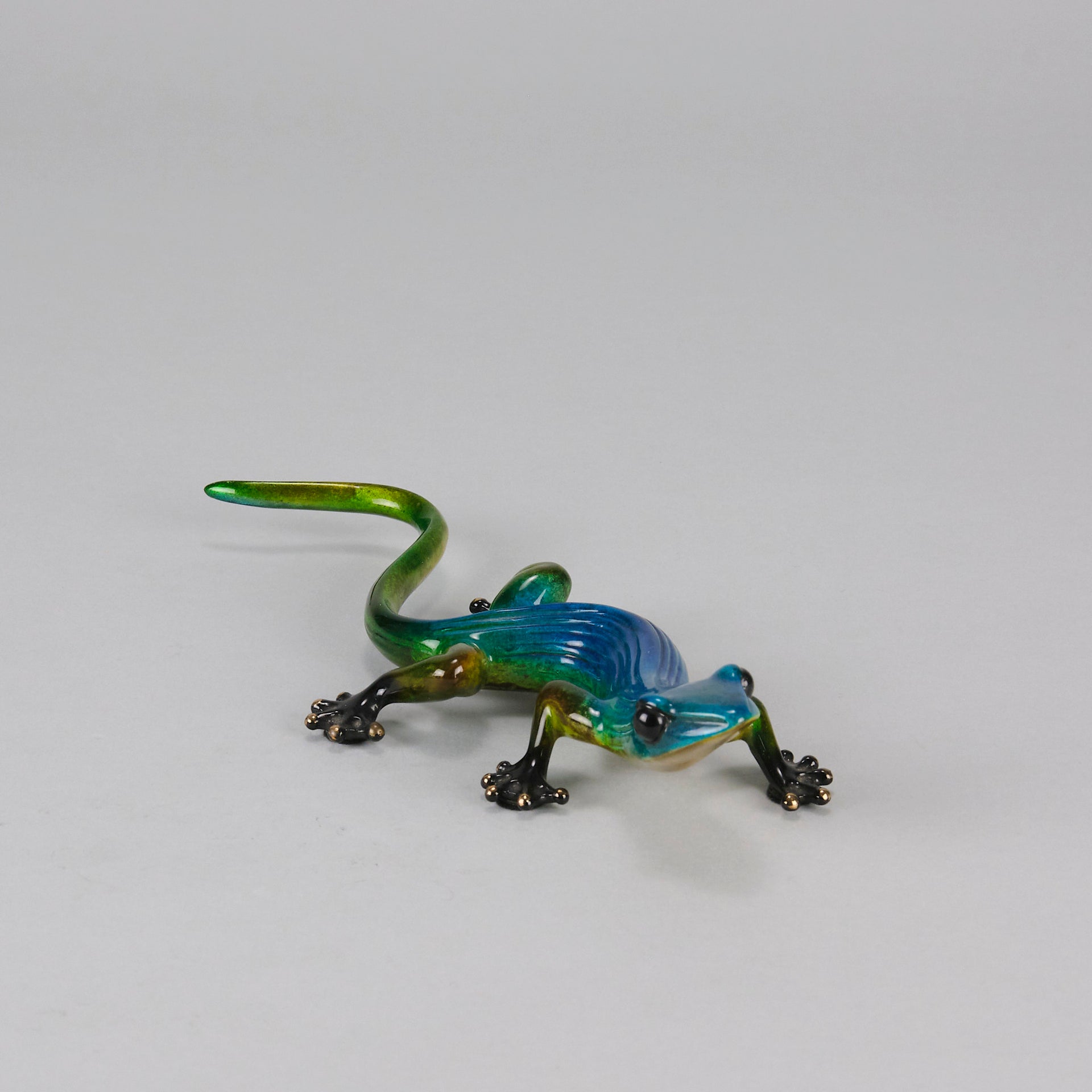 Margarita Gecko by Tim Cotterill a bronze study of a gecko with its head raised exhibiting very fine vibrant colours and excellent surface detail