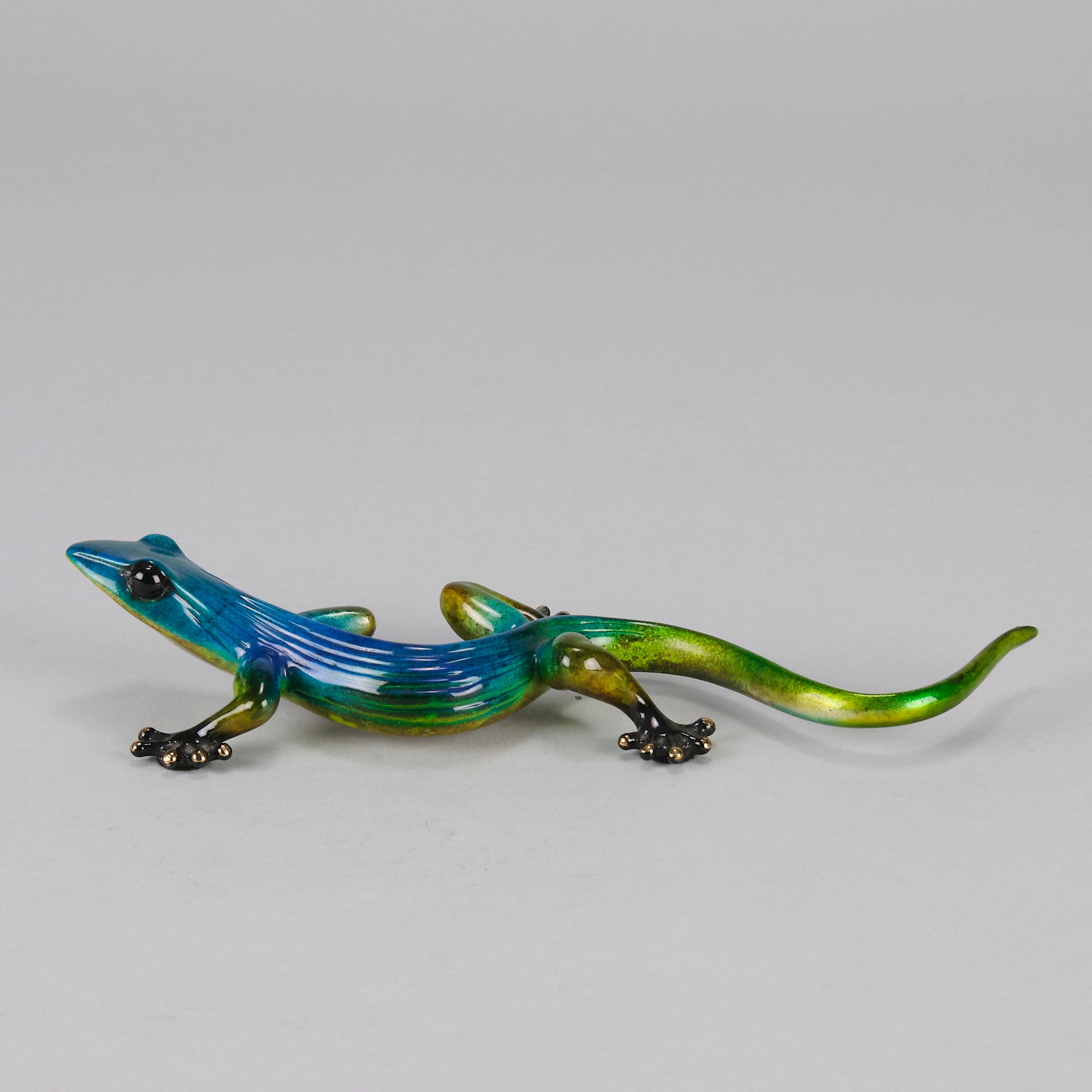 Margarita Gecko by Tim Cotterill a bronze study of a gecko with its head raised exhibiting very fine vibrant colours and excellent surface detail