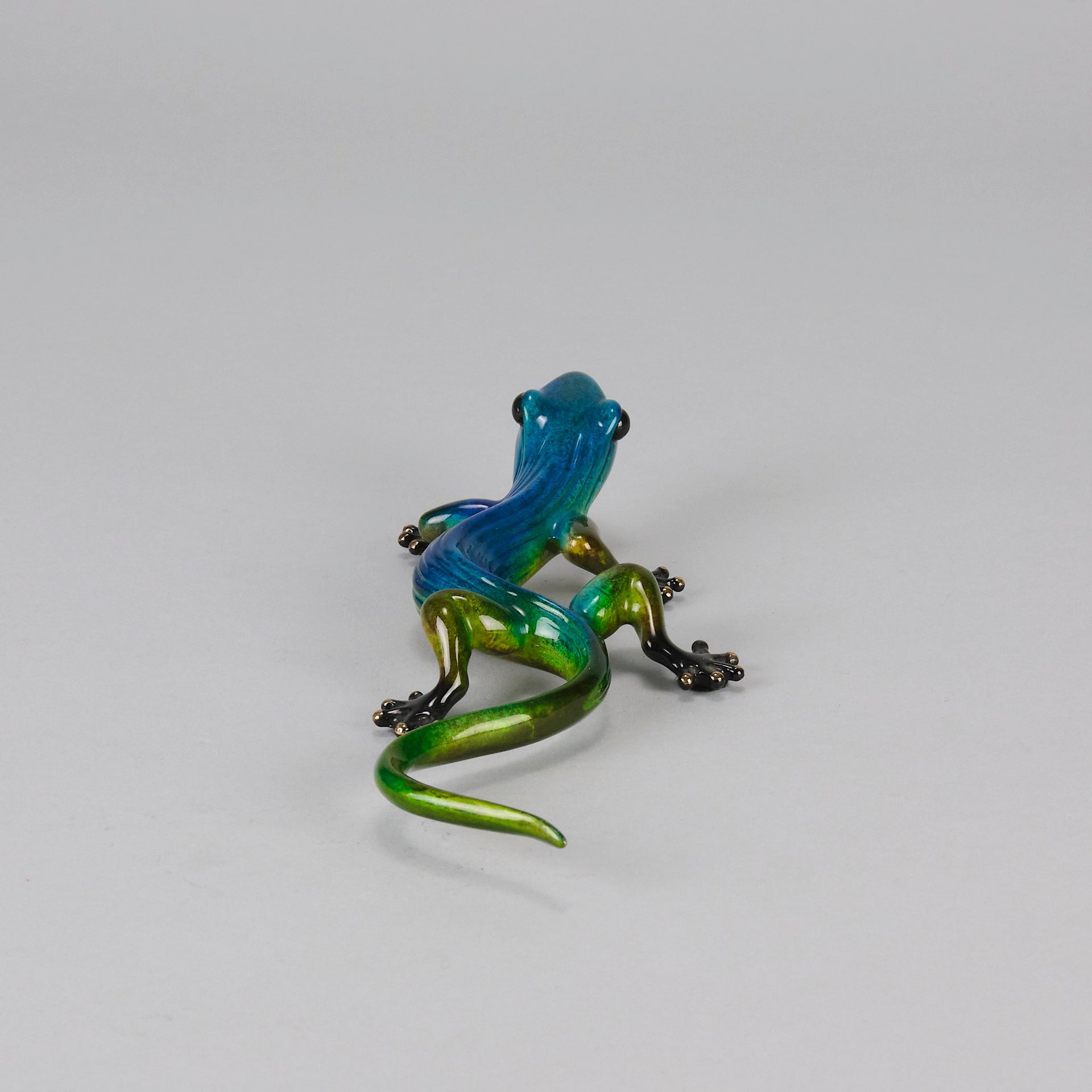 Margarita Gecko by Tim Cotterill a bronze study of a gecko with its head raised exhibiting very fine vibrant colours and excellent surface detail