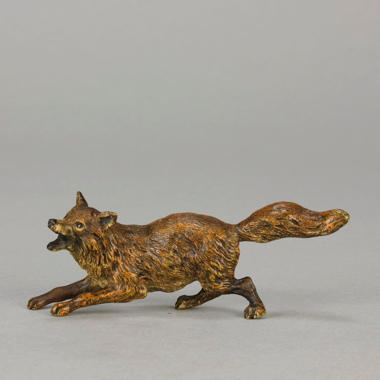 Vienna Bronze Fox A very fine early 20th Century cold-painted Austrian bronze figure of an energetic fox in a running pose