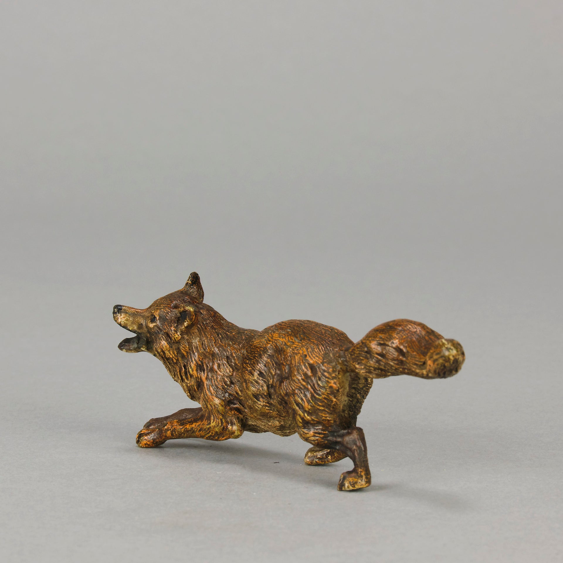 Vienna Bronze Fox A very fine early 20th Century cold-painted Austrian bronze figure of an energetic fox in a running pose