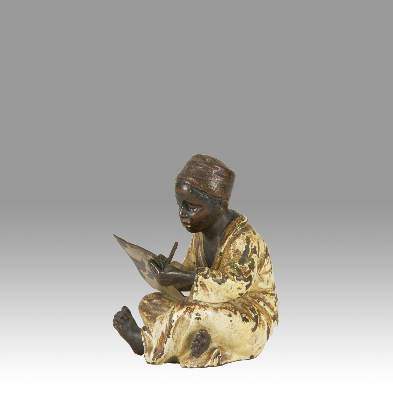 "Seated Boy Writing" by Franz Bergman