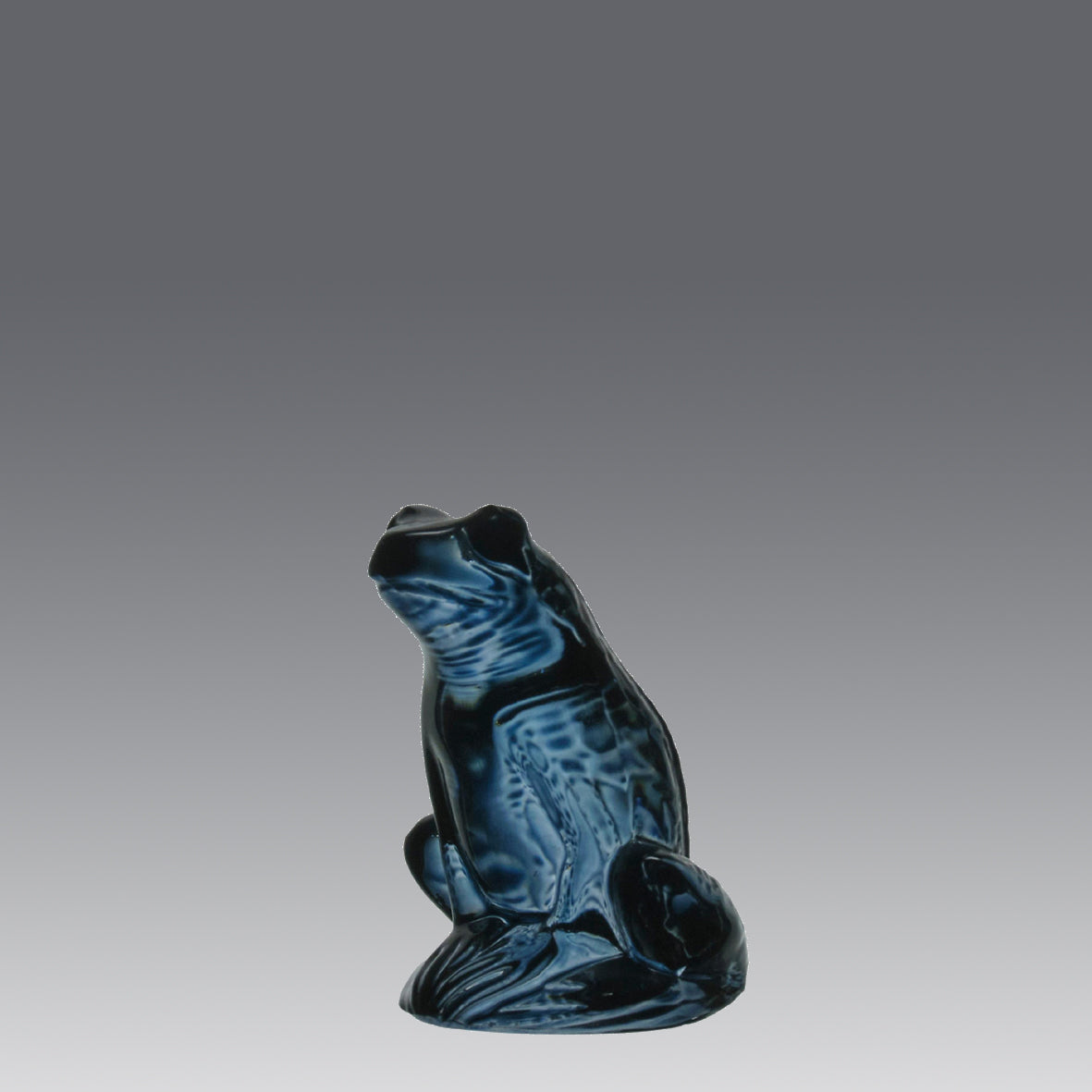 La Grenouille Bleu by Marc Lalique a charming mid 20th Century dark blue polished glass study of a seated frog with a charming look upon its face