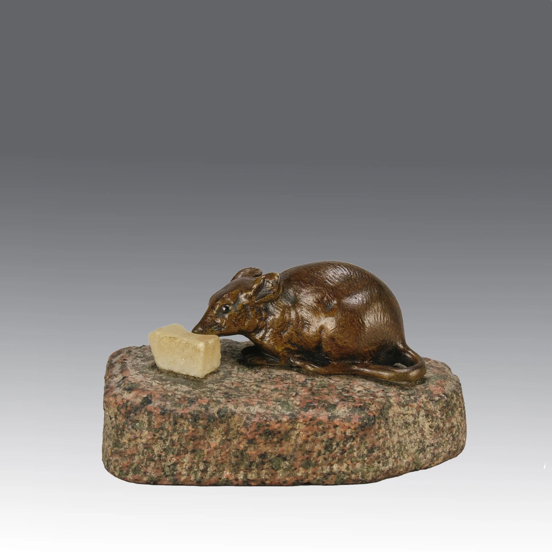 Antique Bronze Statue of a mouse nibbling some cheese depicted in cream marble. The bronze study exhibiting excellent hand chased surface detail and good colour, raised on a rough hewn granite base