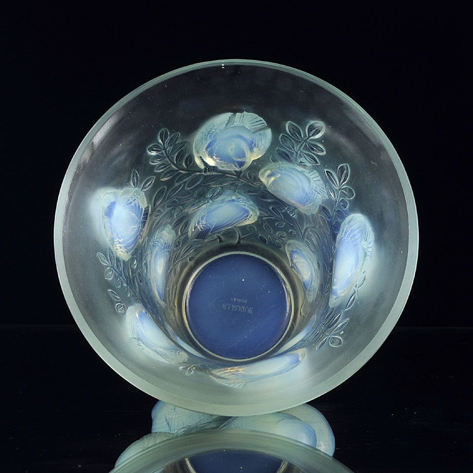 Saint Francois by Rene Lalique an impressive frosted glass vase with flared rim on tapering cylindrical body of opalescent glass, relief-decorated with birds, leaves, and vines with excellent colour