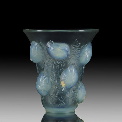 Saint Francois by Rene Lalique an impressive frosted glass vase with flared rim on tapering cylindrical body of opalescent glass, relief-decorated with birds, leaves, and vines with excellent colour